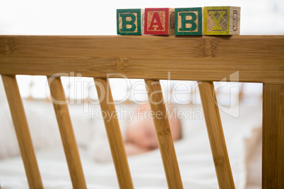 Alphabet blocks on baby bed