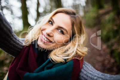 Close-up of smiling woman in forest