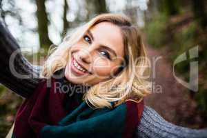 Close-up of smiling woman in forest