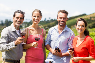 Portrait of happy friends having wine