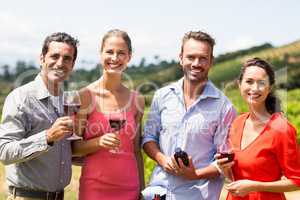 Portrait of happy friends having wine