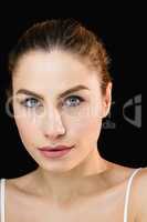 Portrait of beautiful woman posing against black background