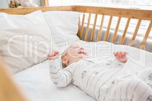 Baby boy relaxing on a cradle