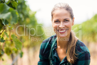 Portrait of happy female vintner