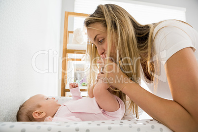 Mother playing with her baby