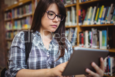 Female student using digital tablet