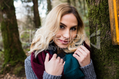 Close-up of smiling woman in forest