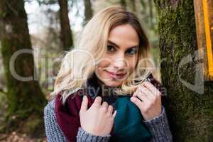 Close-up of smiling woman in forest