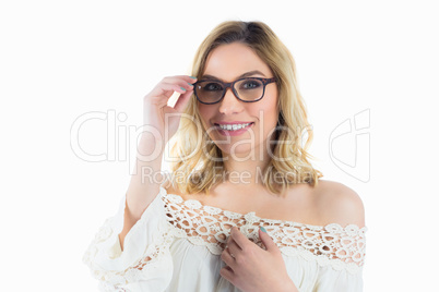 Portrait of beautiful woman posing with spectacles against white background