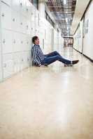 Student sitting in locker room