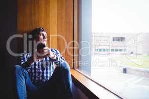 Upset student looking through window