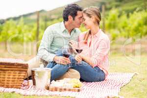 Happy couple holding glasses of wine