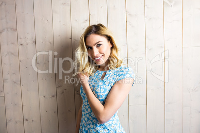 Beautiful smiling woman posing against texture background