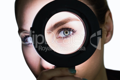 Close-up of beautiful woman in hand mirror