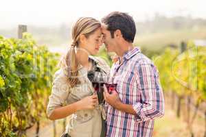 Happy couple holding glasses of wine