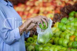 Woman buying an apple