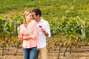 Happy couple holding glasses of wine