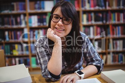 Female student sitting in library