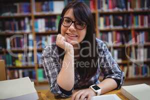 Female student sitting in library