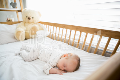 Baby boy sleeping on a cradle