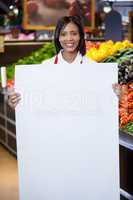 Female staff holding blank sheet