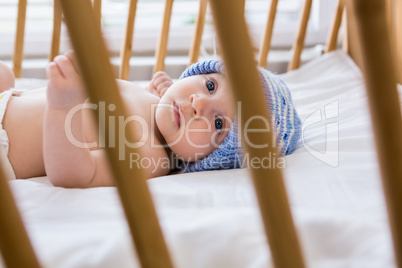 Cute baby boy relaxing on a cradle