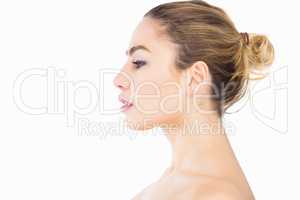 Side view of beautiful woman posing against white background