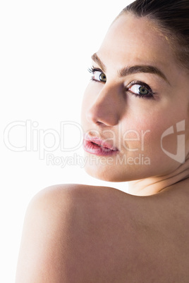 Portrait of beautiful woman posing against white background