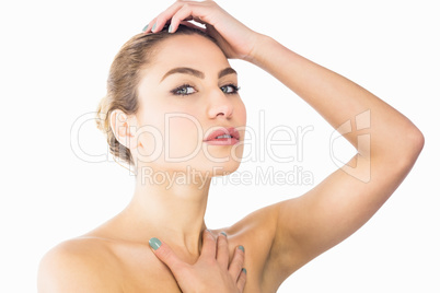 Portrait of beautiful woman posing against white background