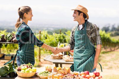 Farmer couple shaking hands with each other