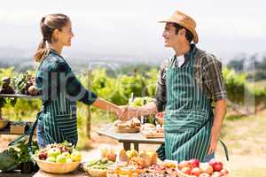 Farmer couple shaking hands with each other