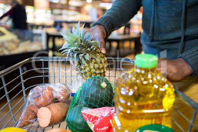Man buying goods in grocery section