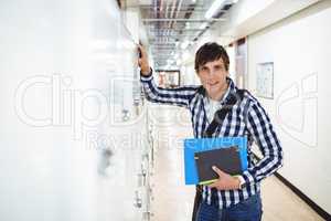 Portrait of student standing in locker room