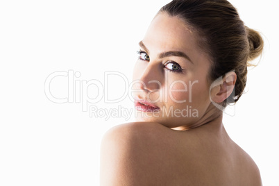 Portrait of beautiful woman posing against white background