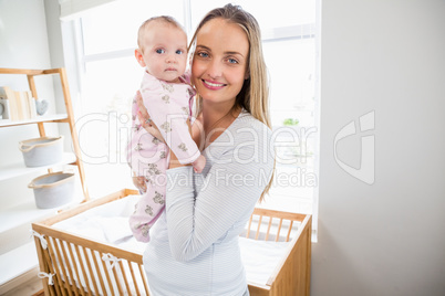 Portrait of mother holding her baby boy