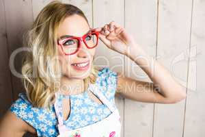 Beautiful woman posing with spectacles against texture background