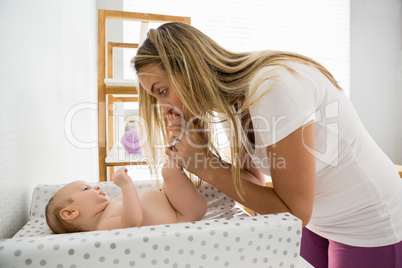 Mother playing with her baby