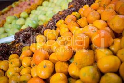 Oranges in tray on display shelf