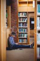 Student using laptop in library