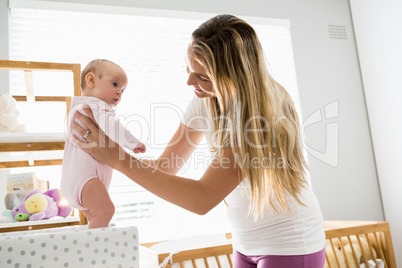 Mother playing with her baby