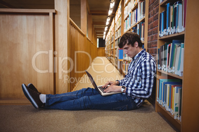 Student using laptop in library