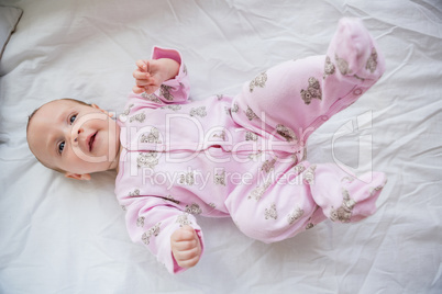 Cute baby boy relaxing on bed