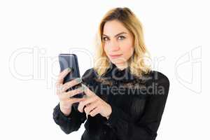 Beautiful woman using mobile phone against white background