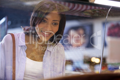 Excited woman looking at display