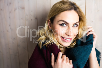 Portrait of smiling woman posing against texture background