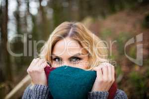 Close-up of beautiful smiling woman in forest