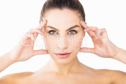 Portrait of beautiful woman posing against white background