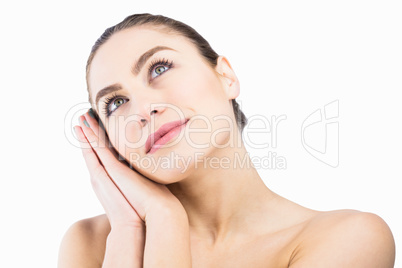 Thoughtful woman posing against white background