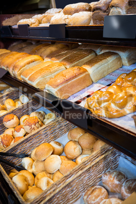 Close-up of various breads on display counter