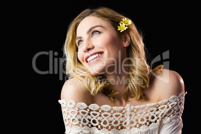 Beautiful smiling woman against black background